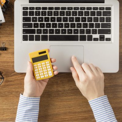 top-view-student-holding-calculator